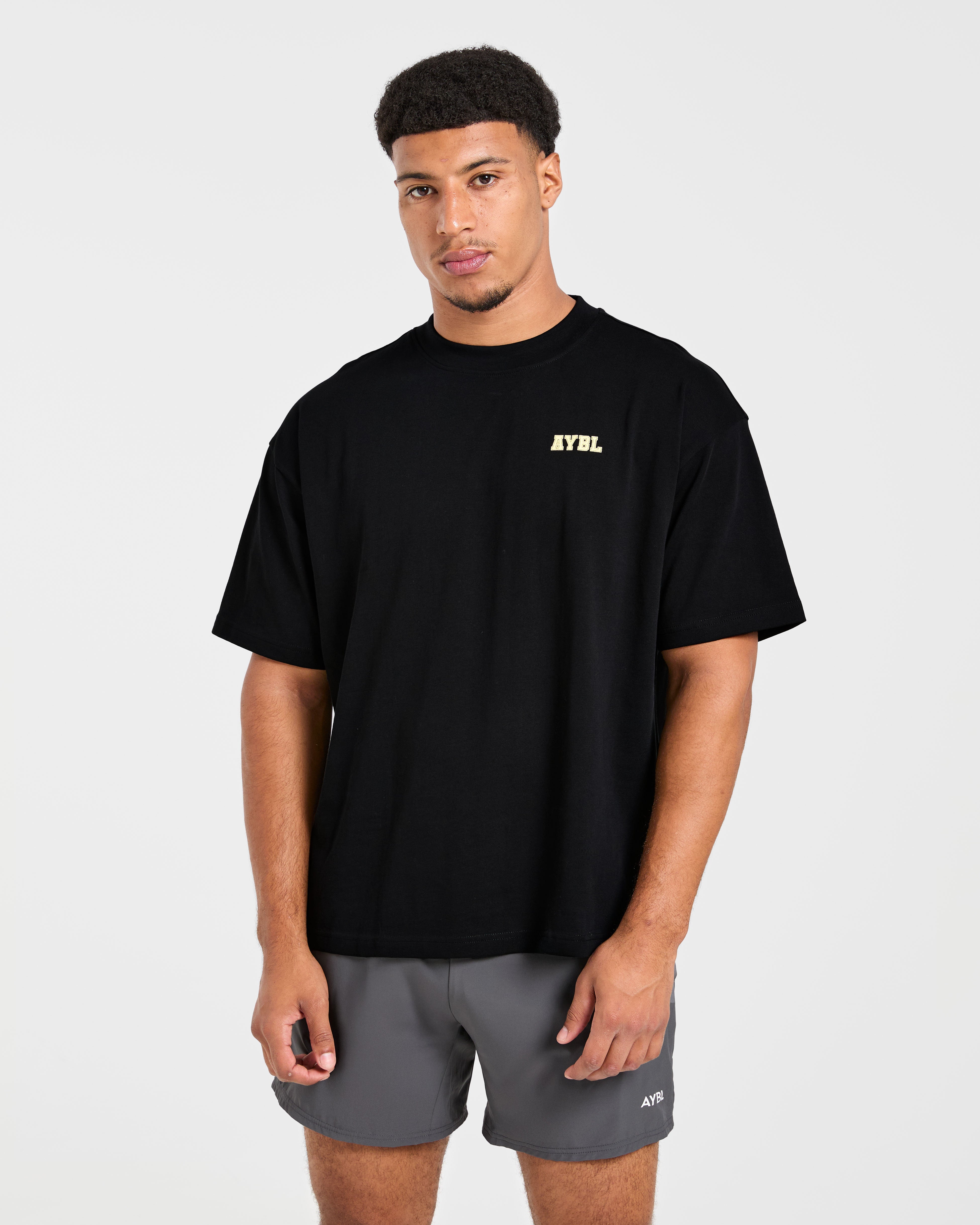 Camiseta Oversized Power In Motion - Negro/Amarillo