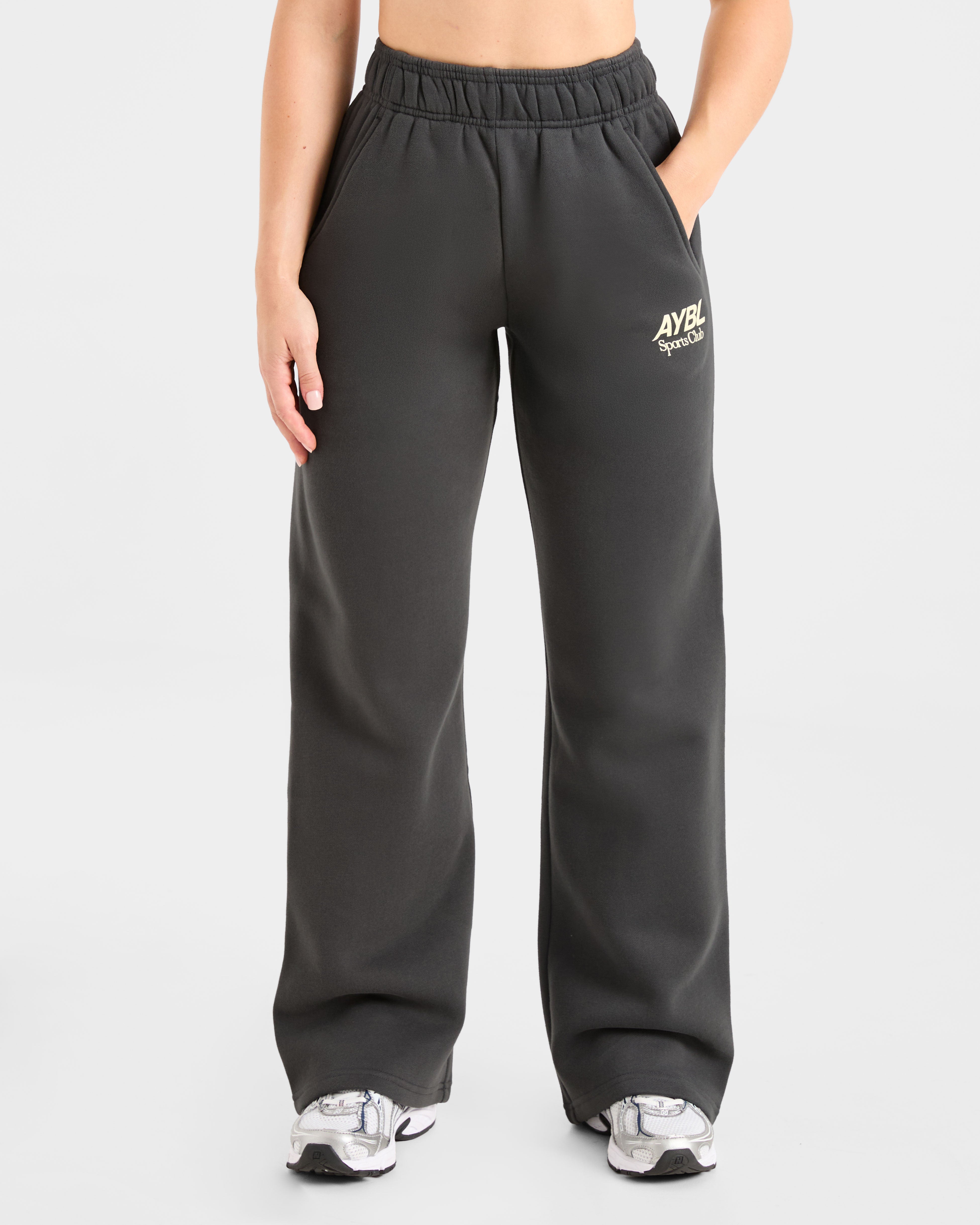 Pantalones Jogger Oversized de AYBL Sports Club - Gris Oscuro/Amarillo