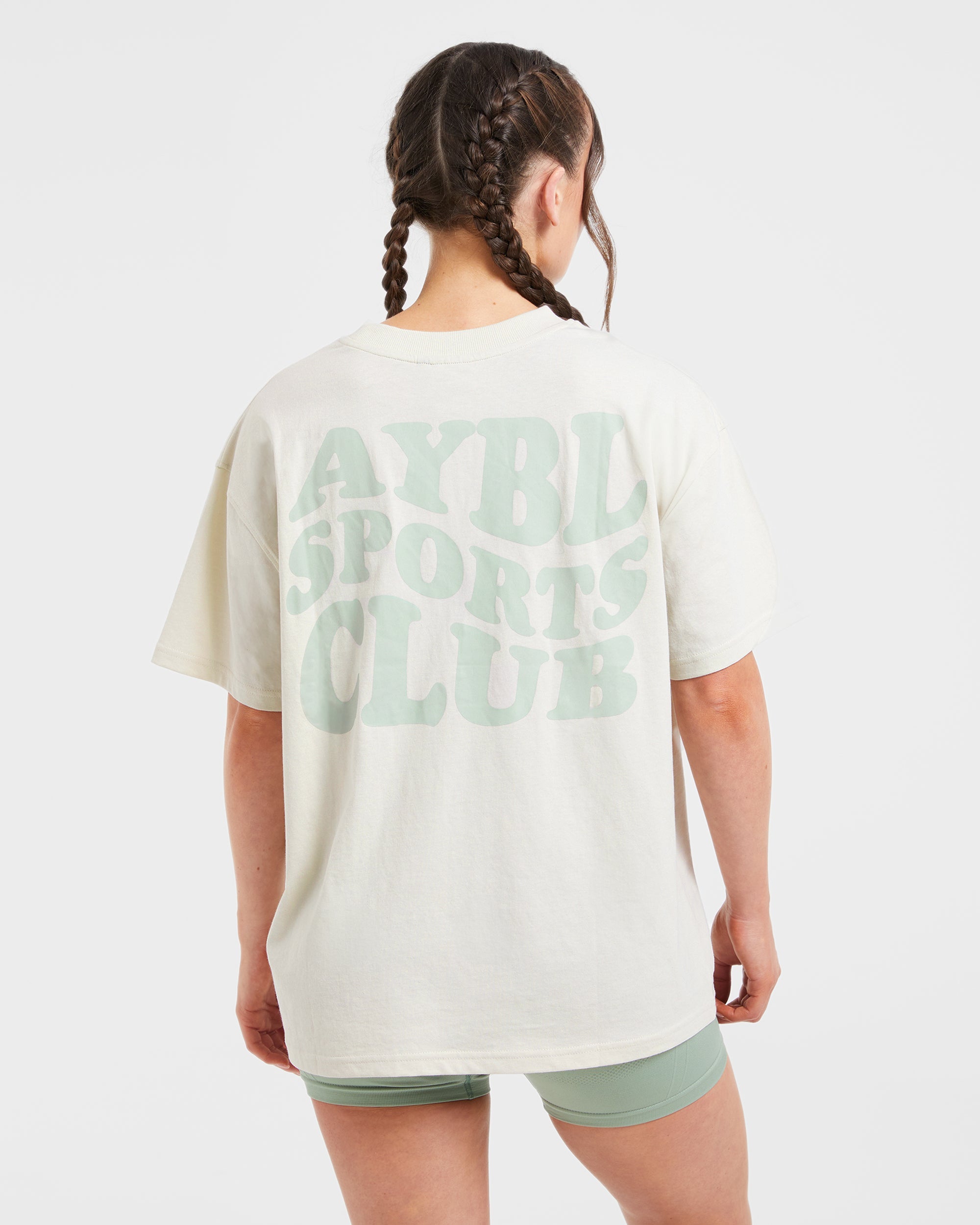 Camiseta Deportiva Sports Club con Estilo Ondulado y Corte Amplio - Blanco Roto/Verde