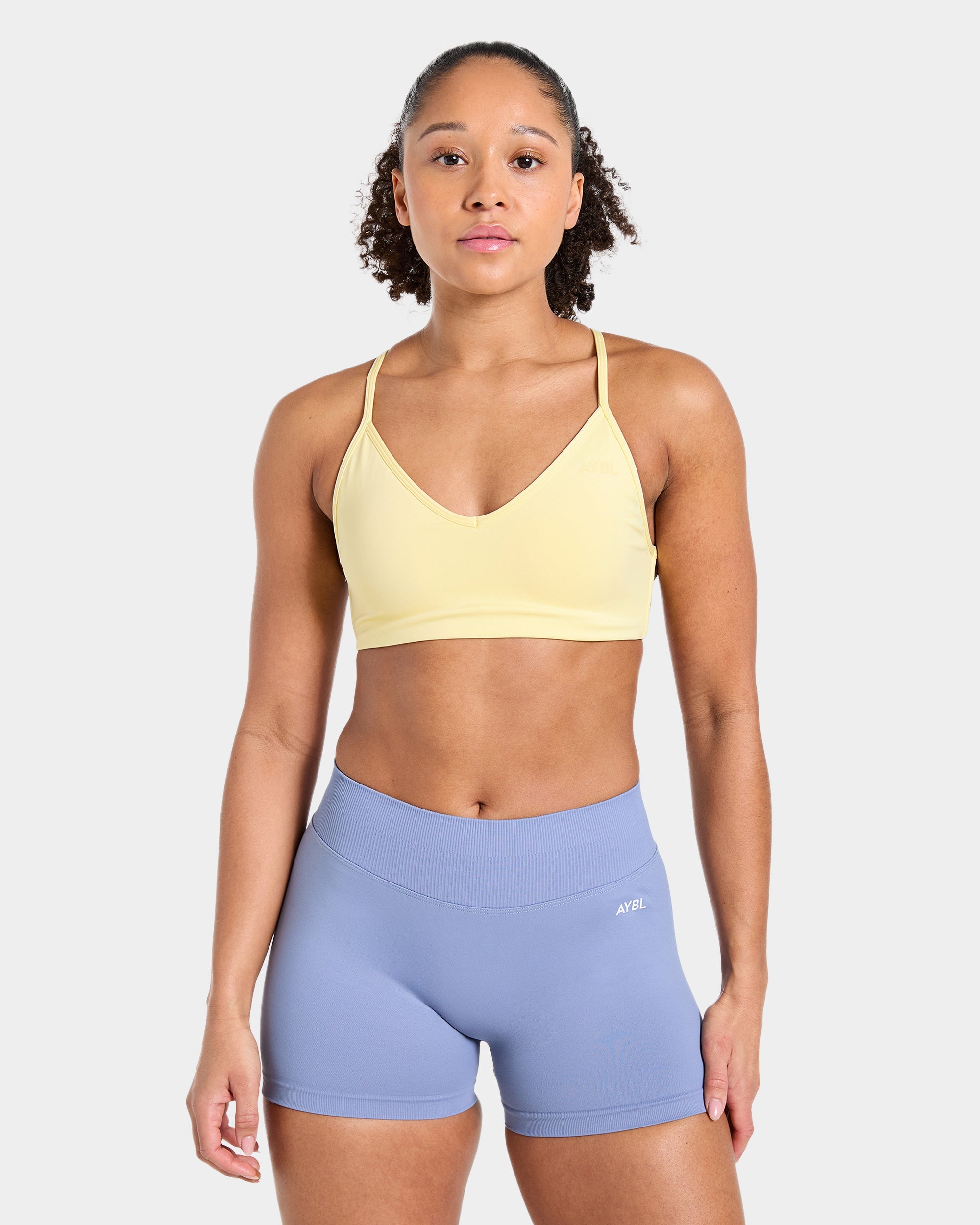 Sports Bra Essential de Espalda Cruzada - Amarillo