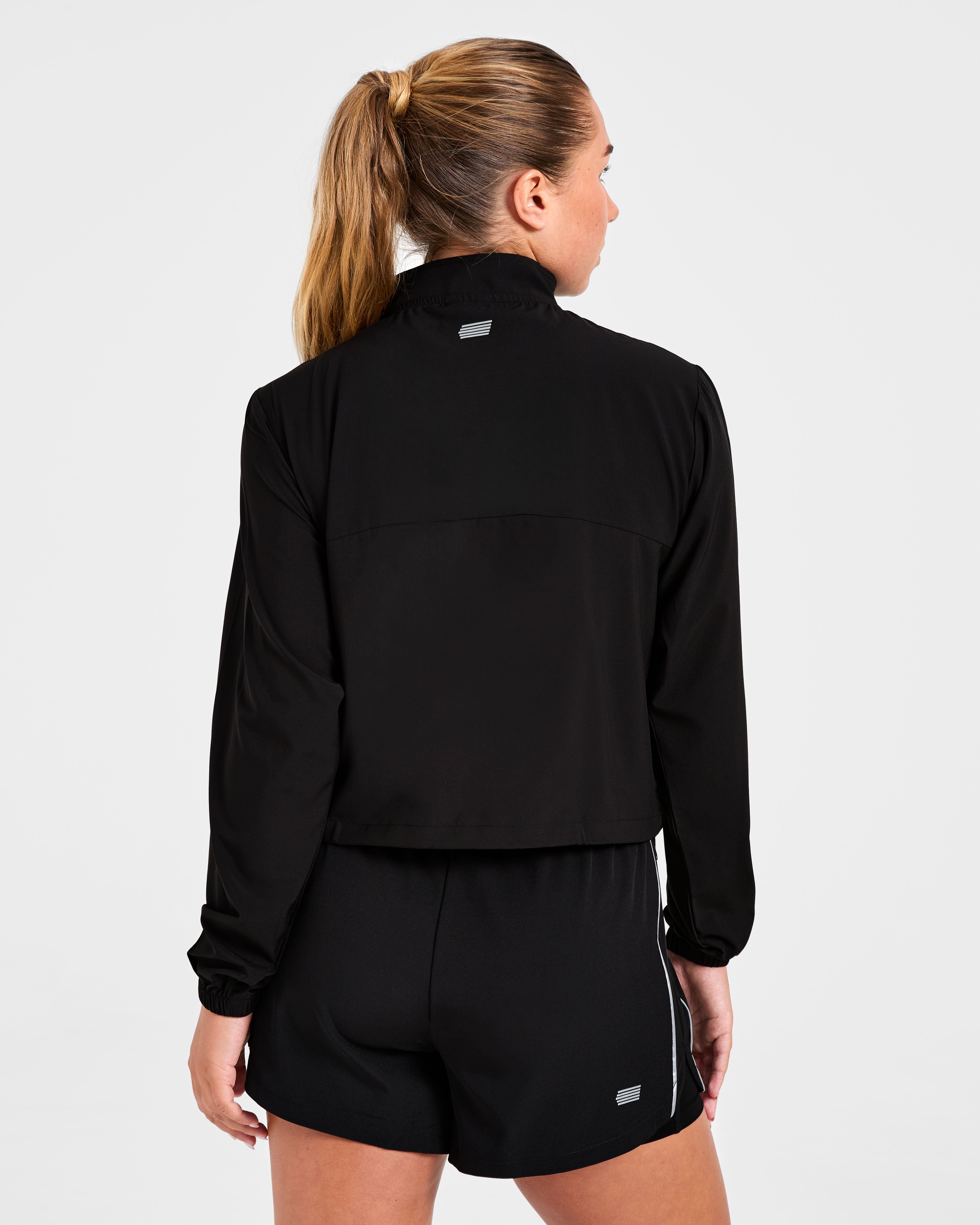 Chaqueta de running con cremallera 1/2 - Negro