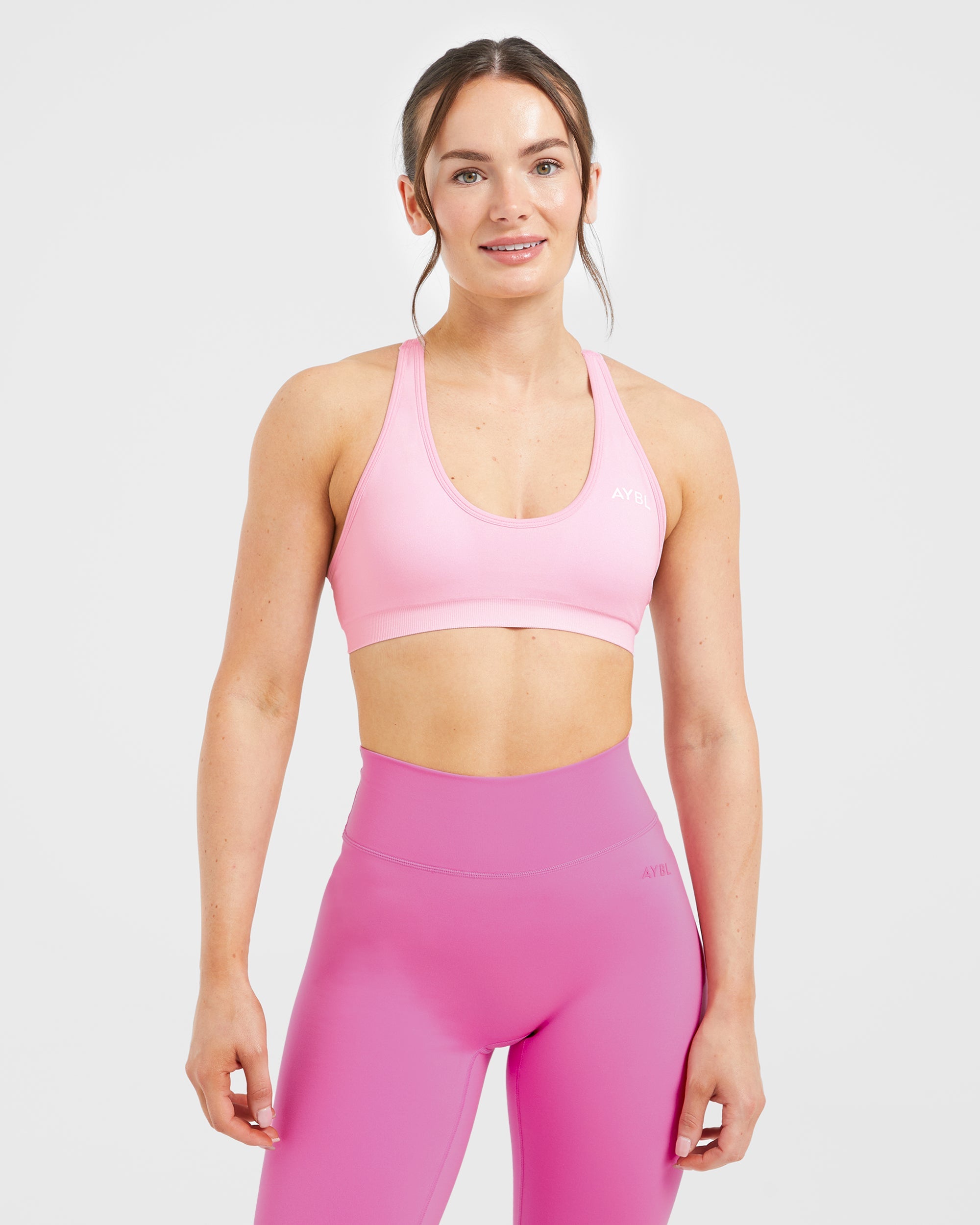 Sports Bra Racer Back Sin Costuras Esencial - Rosa Bebé